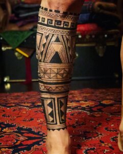Jagua tattoo male calf sleeve Polynesian inspired