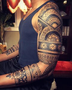 Jagua tattoo male 3/4 sleeve in floral Indian elements