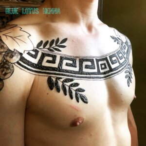 Jagua tattoo male chest piece Greek theme motifs