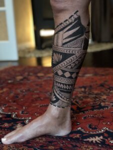Jagua tattoo male calf sleeve Polynesian inspired