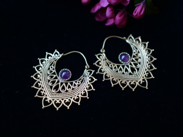 Amethyst earrings set in brass shaped like a lotus petal with mehndi style designs