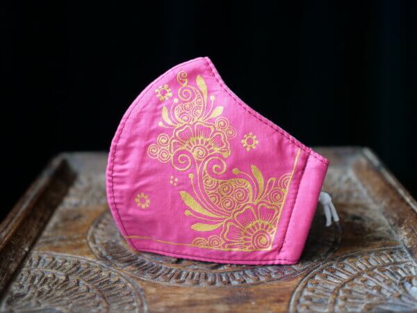 pink cotton face mask with hand painted mehndi design in gold